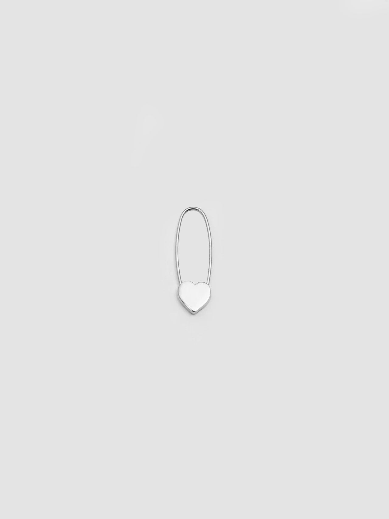 A single sterling silver heart safety pin earring on a white background.