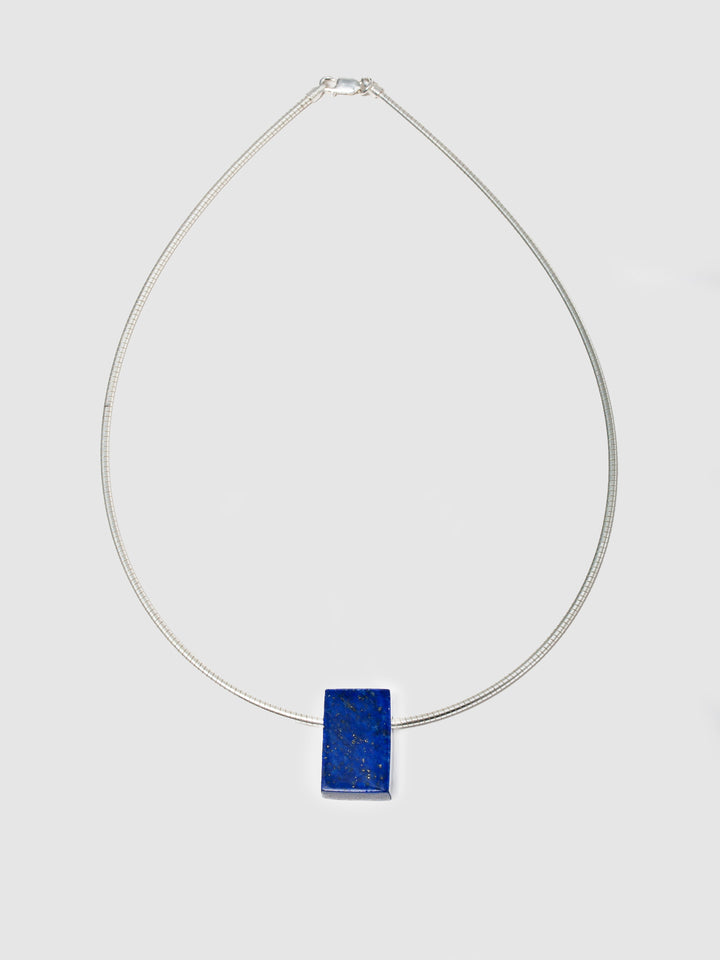 Sterling Silver Lapis Cube Necklace shot on white background.