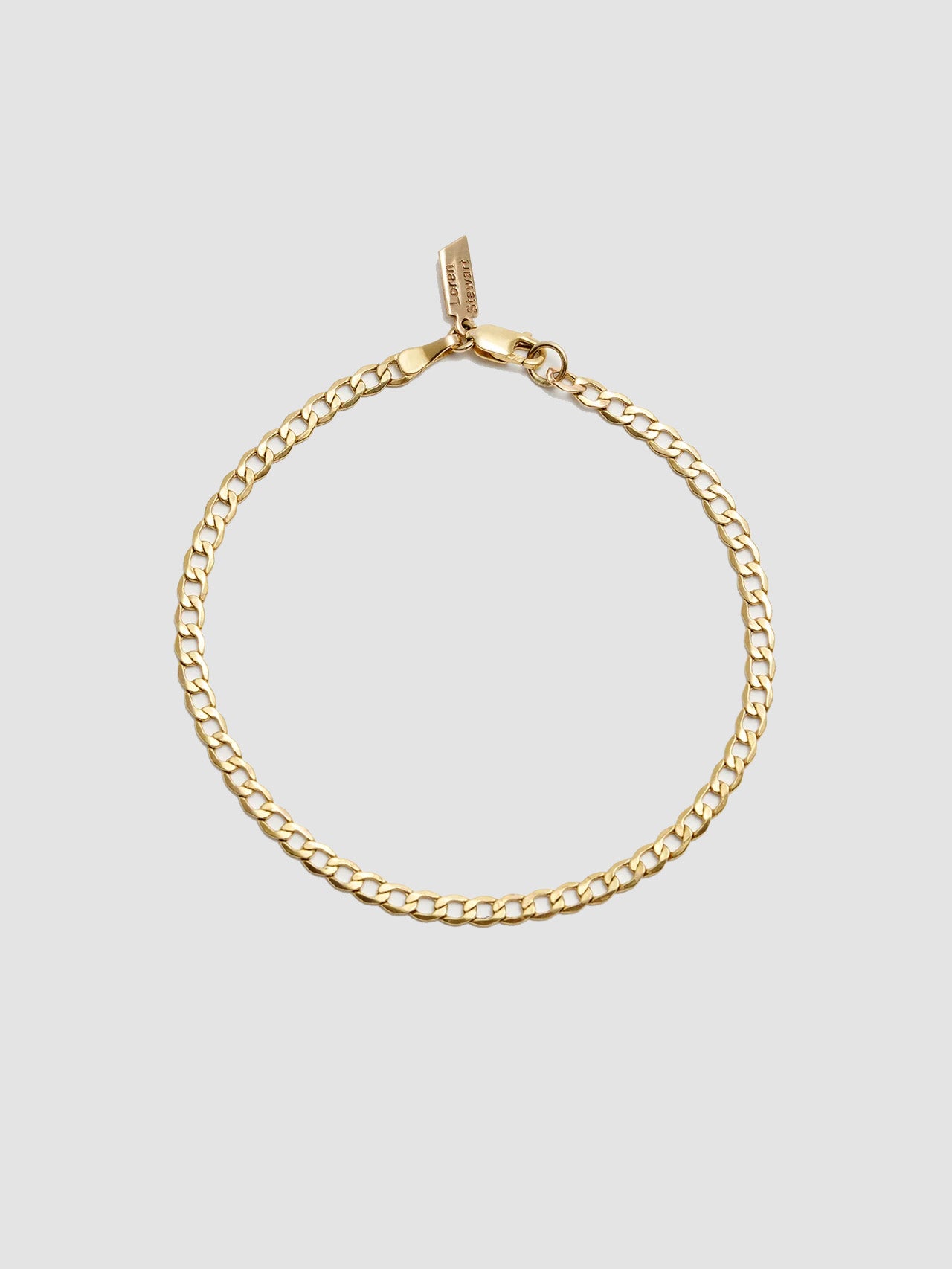 XL Lightweight Havana Chain Bracelet: 14Kt Yellow Gold-Plated Sterling Silver Hollow Chain Bracelet Length: 7” Width: 3.3mm