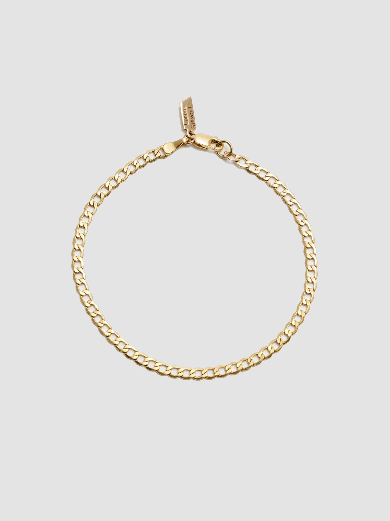 XL Lightweight Havana Chain Bracelet: 14Kt Yellow Gold-Plated Sterling Silver Hollow Chain Bracelet Length: 7” Width: 3.3mm