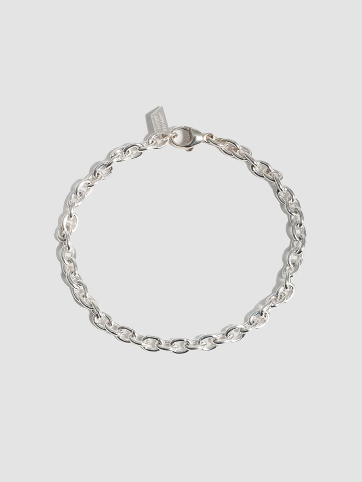 Sterling Silver Cable Chain Bracelet pictured on light grey background. 