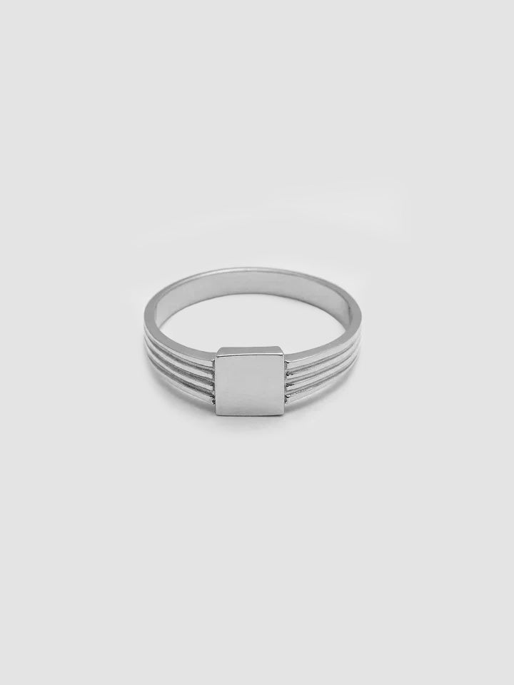A sterling silver square ID signet ring with a tapered band, displayed against a white background.