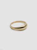 Side angle product shot of Dome Ring (14Kt Yellow Gold Dome Ring with a 5.3mm to 1.9mm Tapered Width) shot on white background