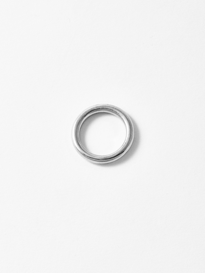 Sterling Silver Tube Ring pictured on light grey background. 