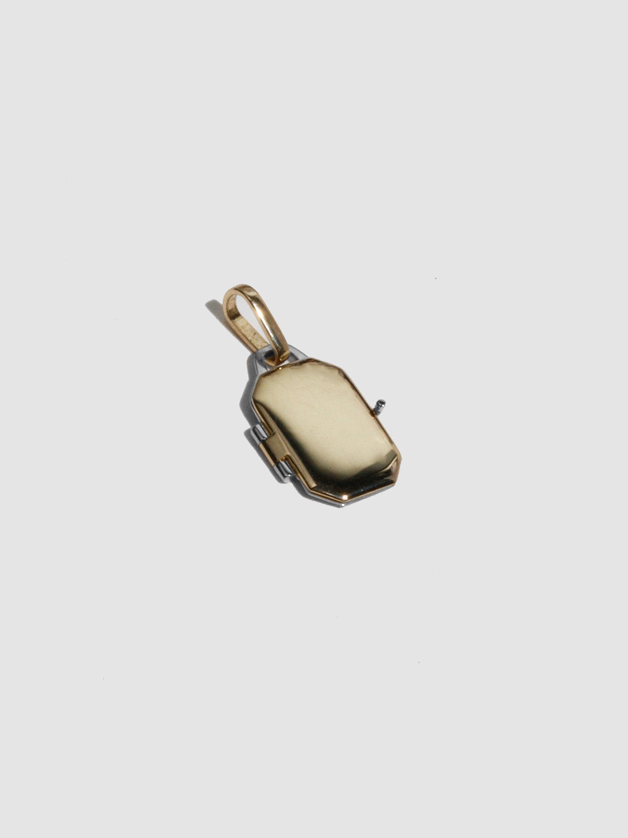 Mixed Metal Octagonal Locket Pendant pictured on a light gray background