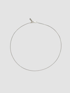 Sterling Silver Snake Chain Necklace pictured on light grey background.