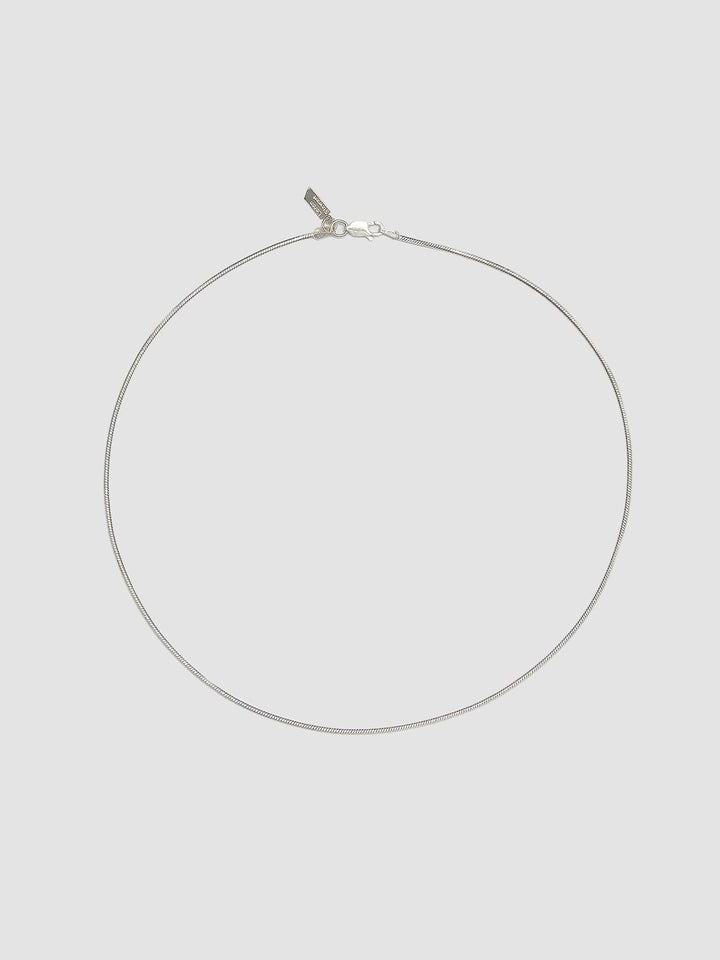 Sterling Silver Snake Chain Necklace pictured on light grey background.