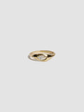 Gold ring with a diamond on a light gray background