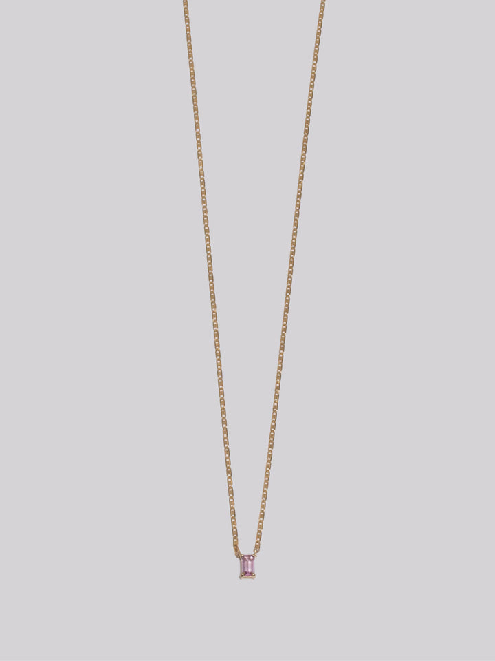10k Yellow Gold Sapphire Valentino Necklace pictured on light grey background. 
