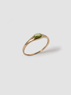 14kt Yellow Gold Signet Mini Gem Signet pictured on light grey background. Peridot stone. 