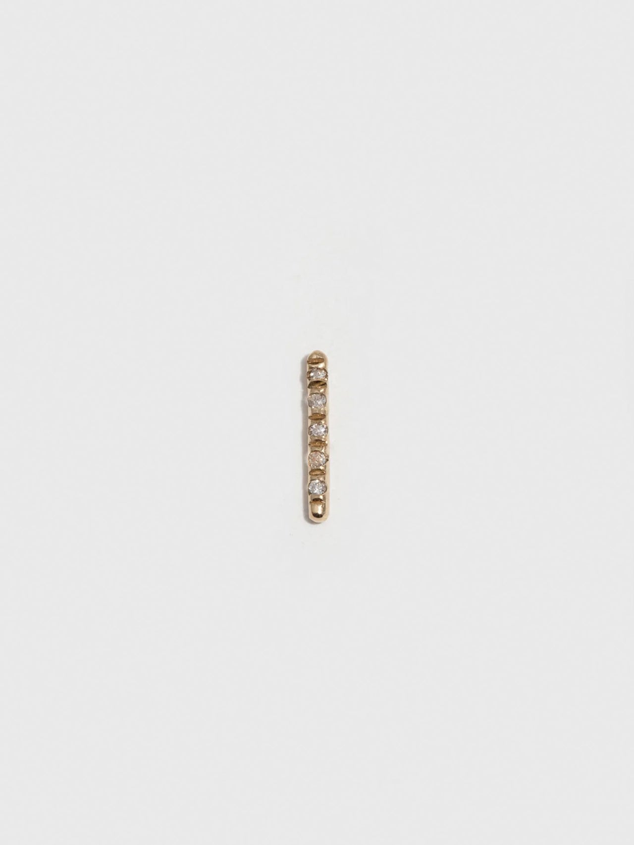 14kt Yellow Gold Solo Diamond Rod Stud Earring pictured on light grey background. Single.