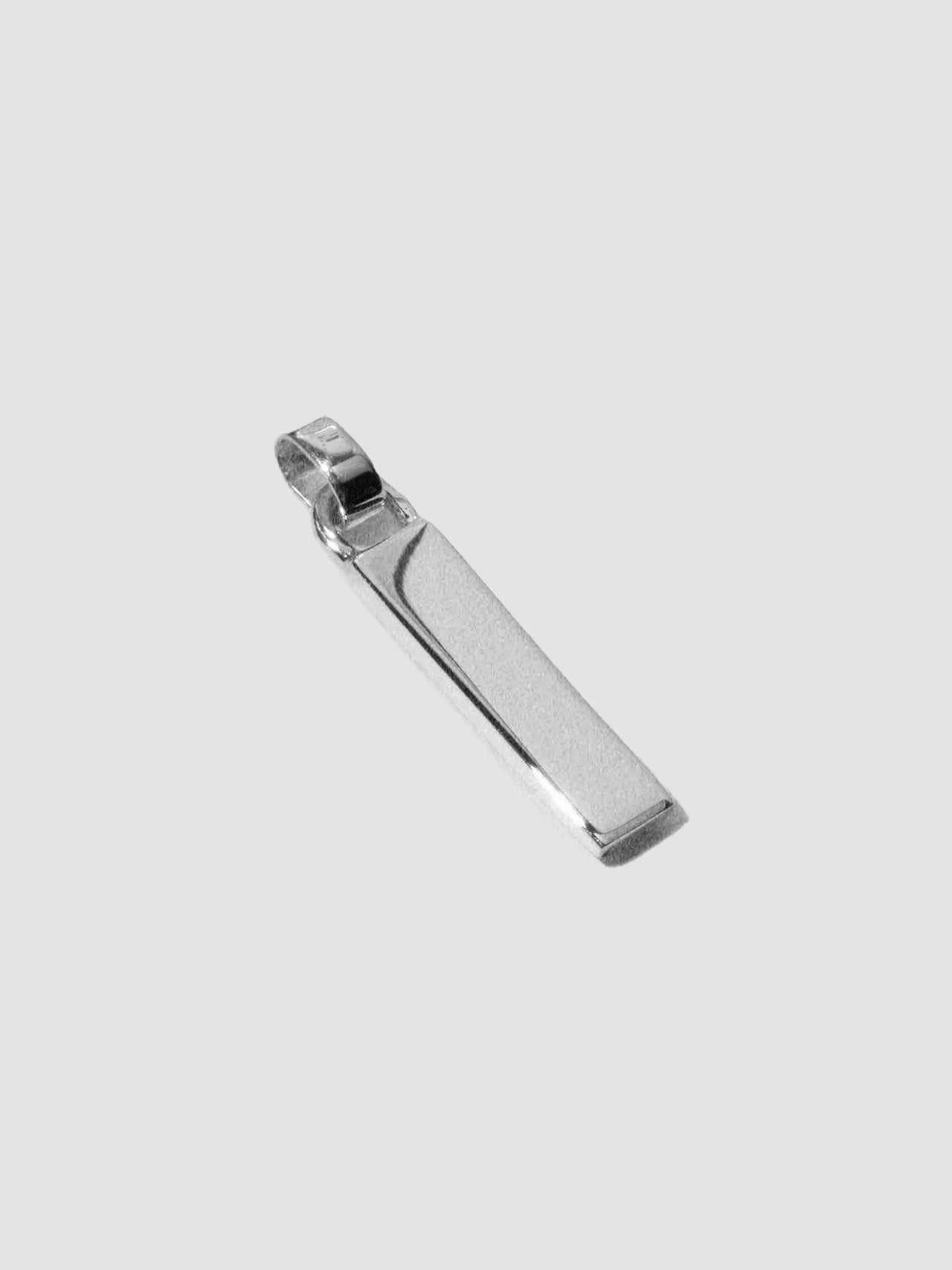 Zipper Pendant pictured on light grey background.