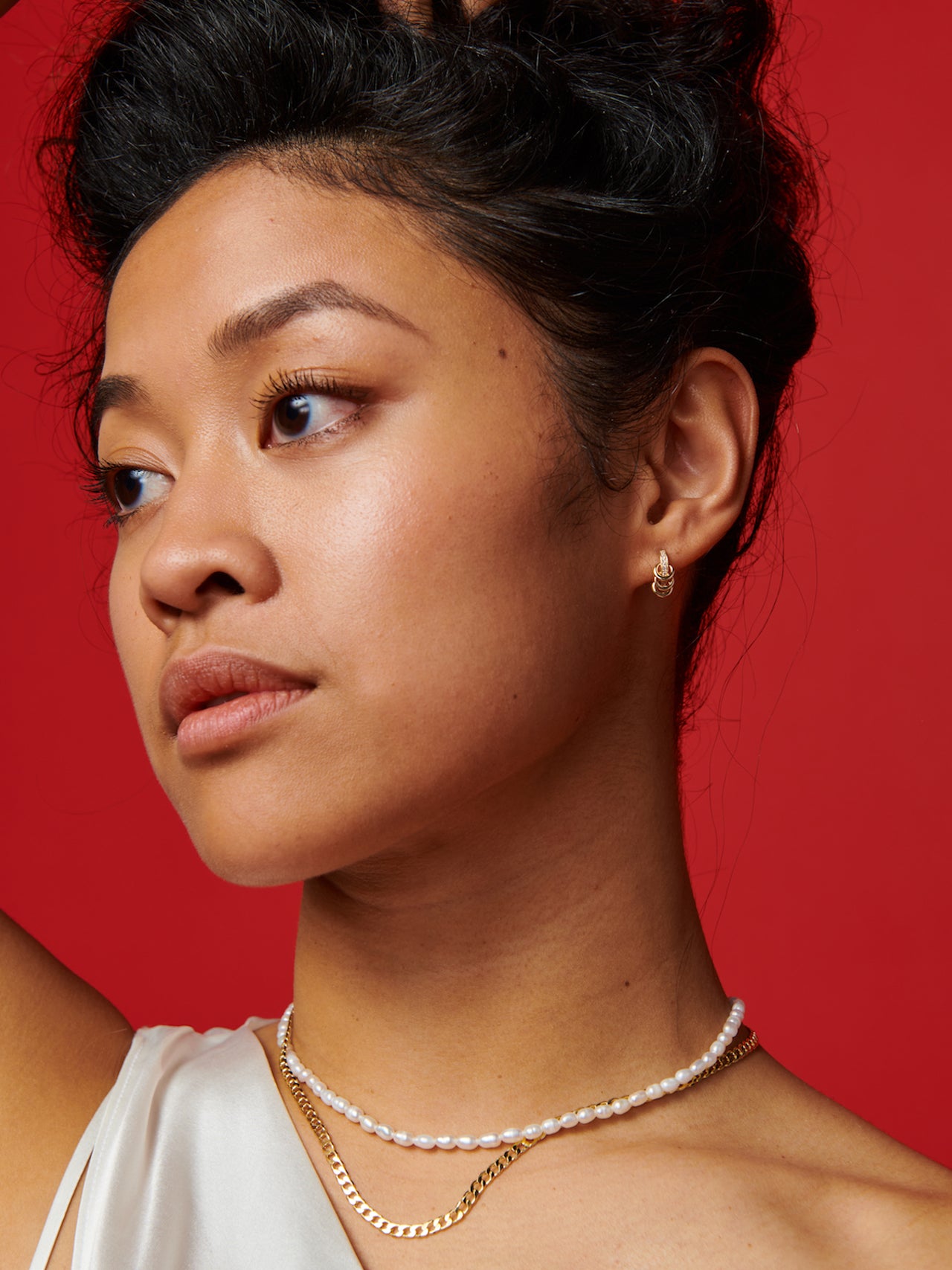 14kt Yellow Gold Rice Pearl Choker pictured on model.