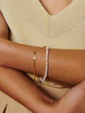 14kt Yellow Gold Freshwater Pearl Bracelet pictured on models wrist. 