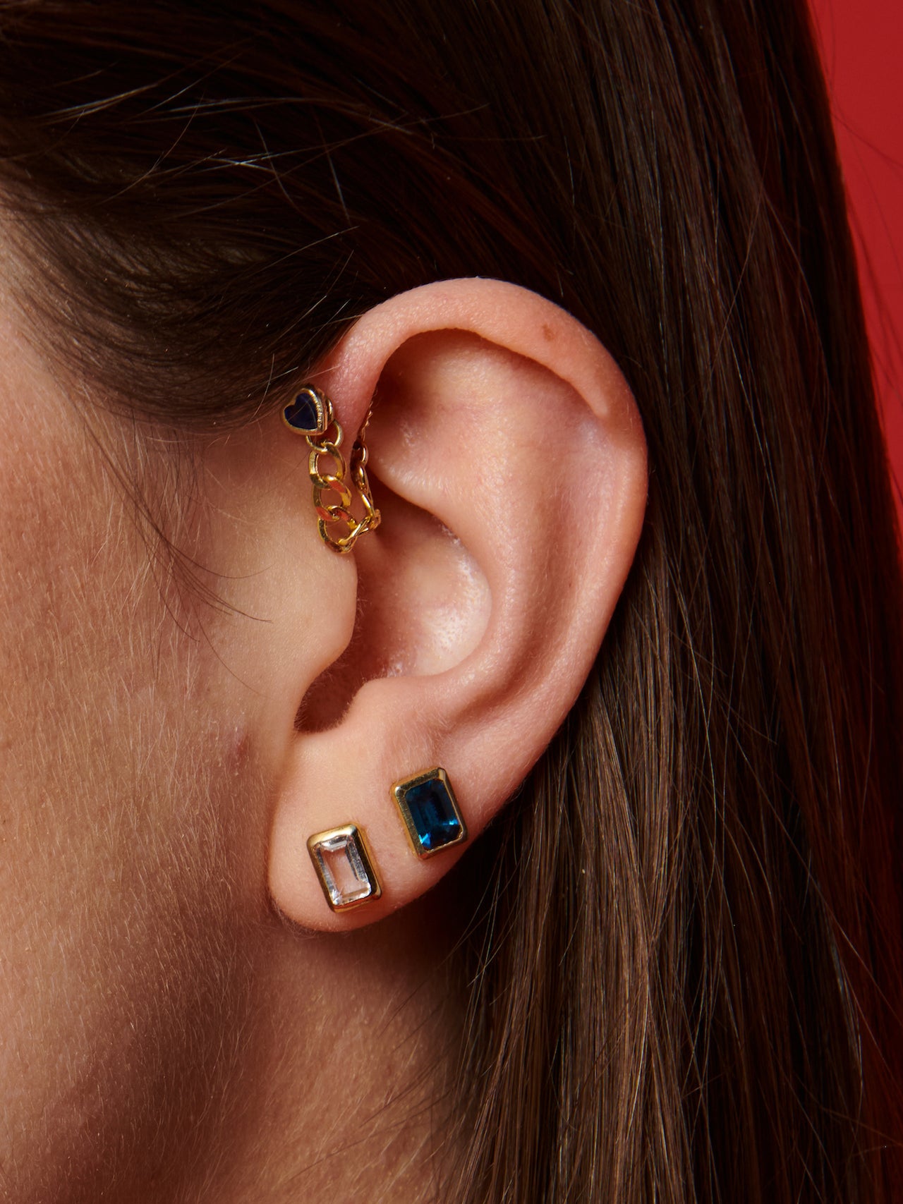 14kt Yellow Gold Heart Gemstone Studs pictured on ear. Shown in cartilage piercing.