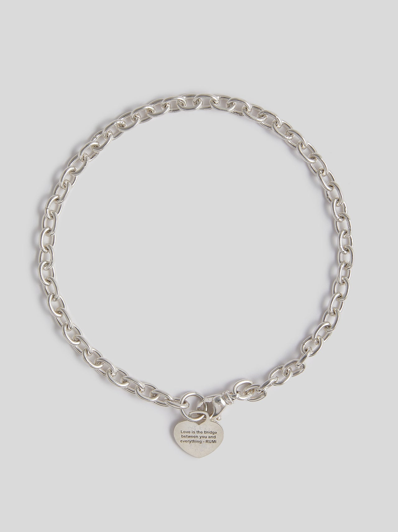 Sterling Silver Rumi Wrap Charm Choker pictured on light grey background. 