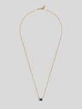 Product shot of Necklace with thin yellow gold chain and blue rectangle topaz pendant. Shot on white background.   