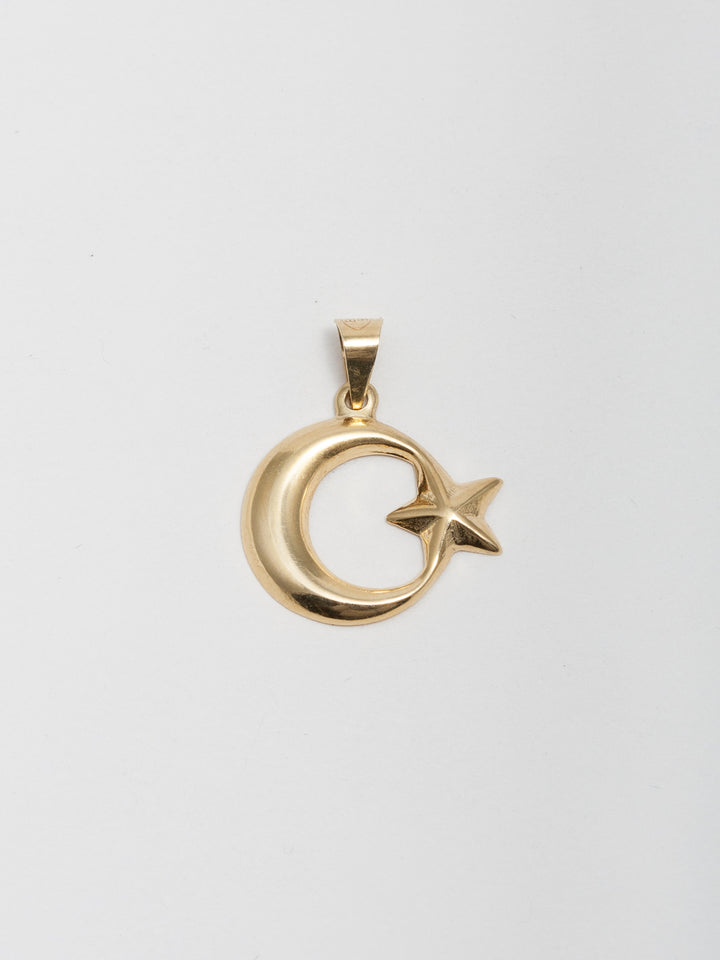 14Kt Yellow Gold Crescent Moon & Star Pendant pictured on light grey background.