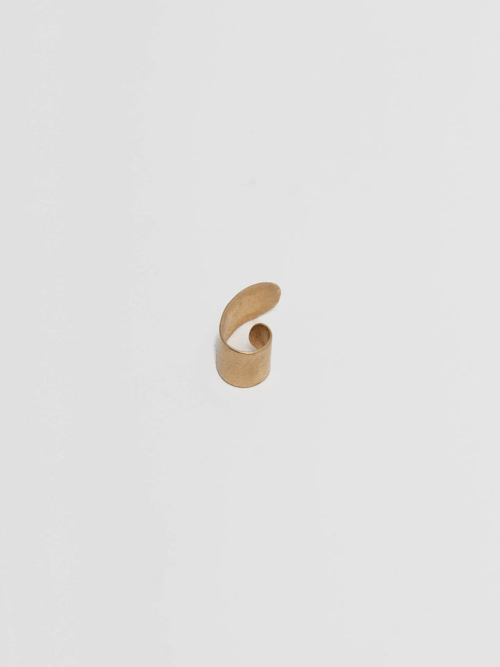 14kt Yellow Gold Ear Cuff pictured on light grey background.