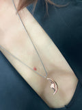 14Kt Rose Gold Solid Moon Pendant on sterling silver chain. Shot on model.