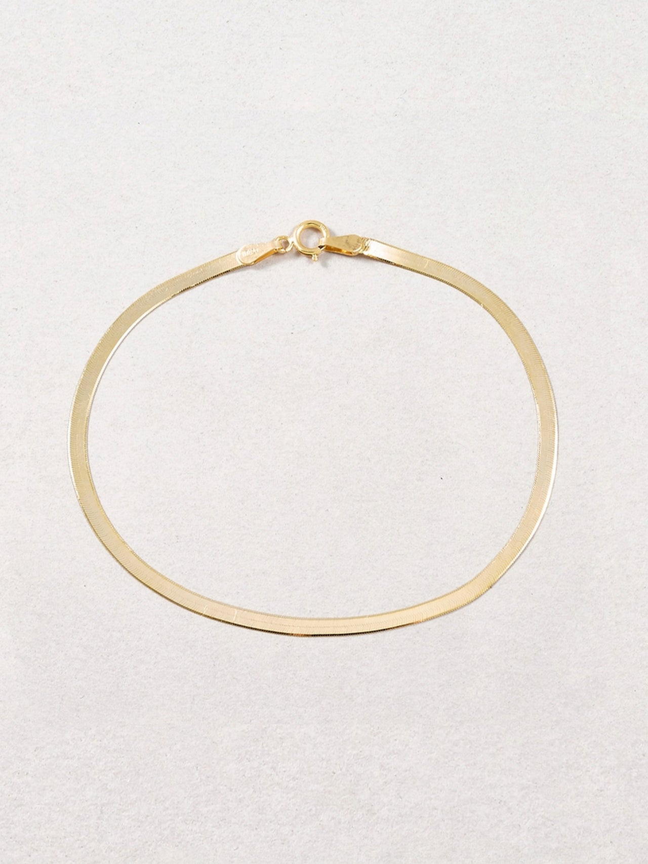 Herringbone Bracelet:10Kt Yellow Gold Italian Herringbone Chain Bracelet  Length: 7”  Width: 2.5mm