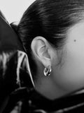 Sterling Silver Crescent Moon Earrings pictured on model.
