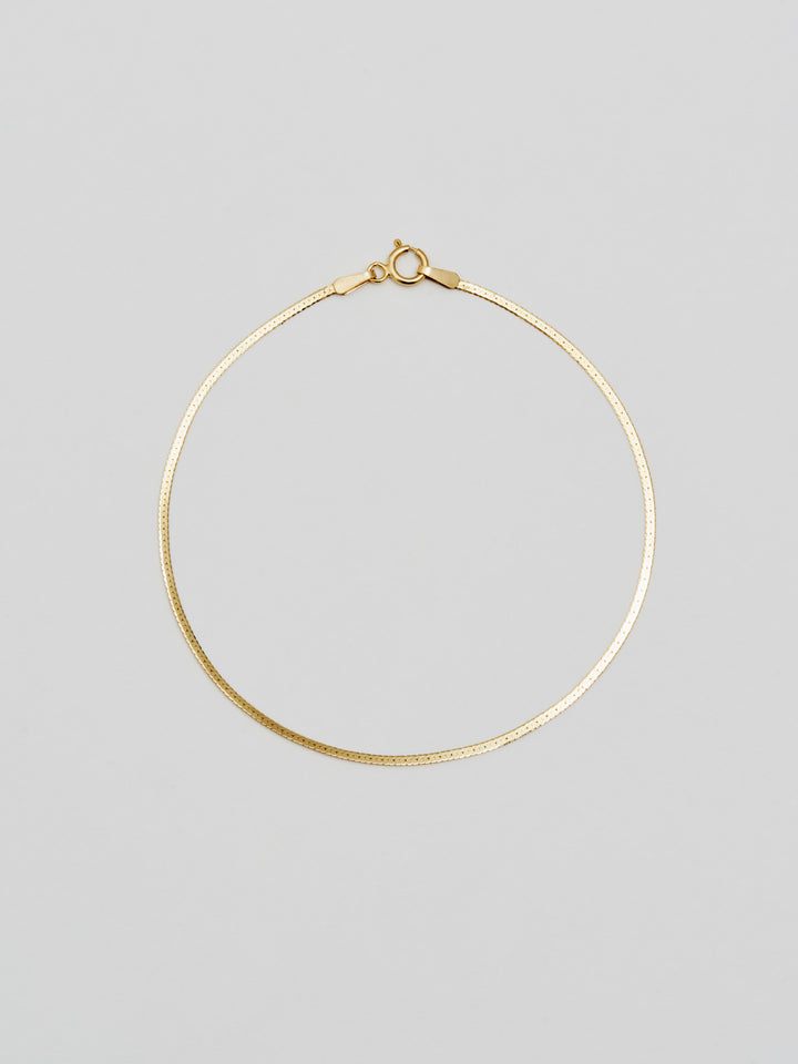 Demi Herringbone Bracelet: 10Kt Yellow Gold Slender Herringbone Chain Bracelet Width: 1.8mm Length: 8"