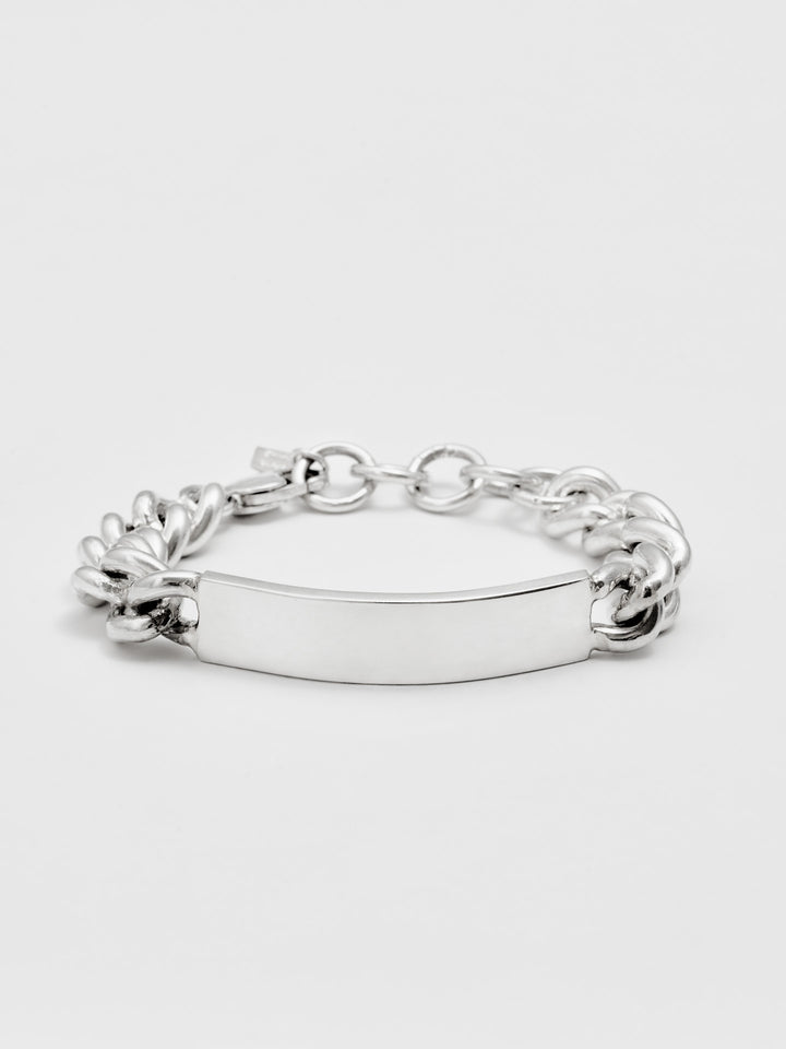 Sterling Silver Solid Curb Chain ID Bracelet pictured on light grey background. 