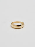 Product shot of the front of Baby Dome Ring (shiny 14Kt Yellow Gold Dome Ring Tapered Width) with white background. 