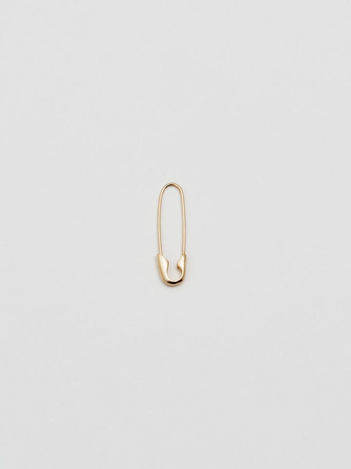 Product shot of the Safety Pin Earring (14Kt Shiny Yellow Gold Safety Pin Earring  Length: 21.35mm) Background: Grey backdrop
