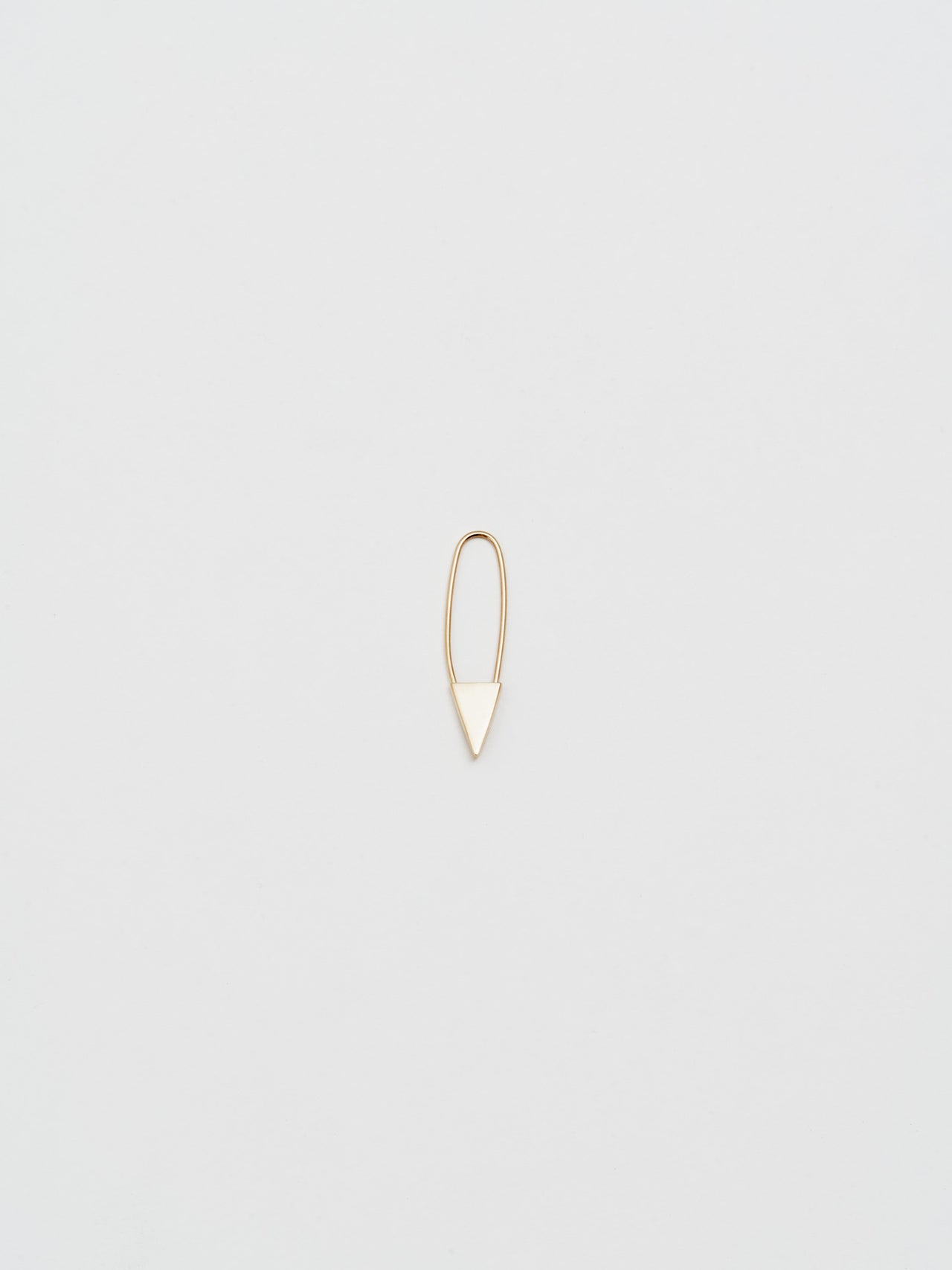 Mini Triangle Safety Pin Earring in Yellow Gold, light grey background.