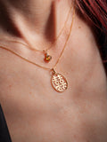 10Kt Yellow Gold Heart Necklace with Yellow CZ pictured on model.