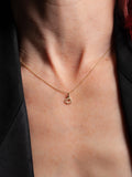 14Kt Yellow Gold Handcuff Charm pictured on models neck.