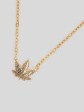 Close up Product image of thin yellow gold chain necklace with small gold pot leaf pendant. 