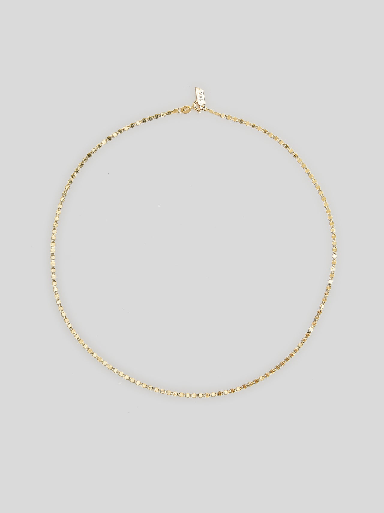Product image of yellow gold valentino chain necklace on white background. 