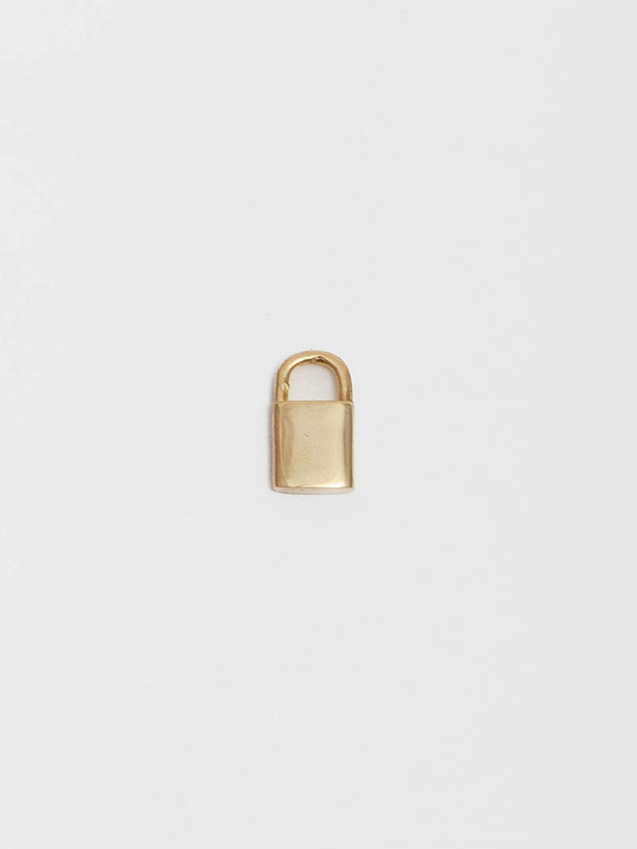 14kt Yellow Gold Padlock Charm pictured on light grey background. 