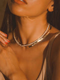 Seed Pearl Safety Pin Choker shot on model. Styled with safety pin closure in the back. 