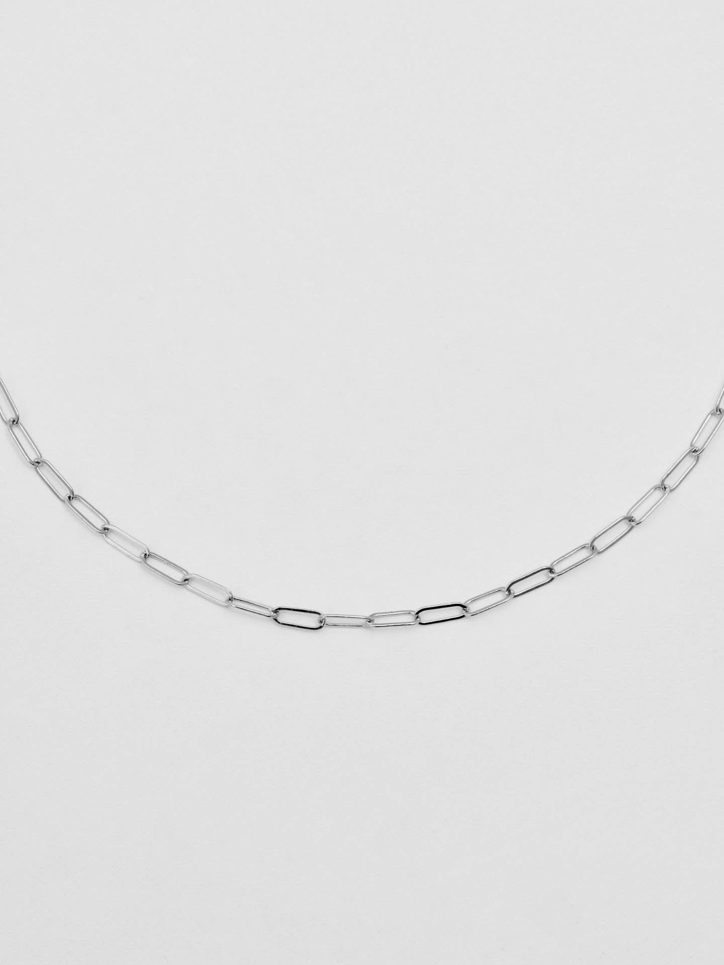 Close up picture of the Sterling Silver Lightweight Long Link Chain pictured on light grey background. 