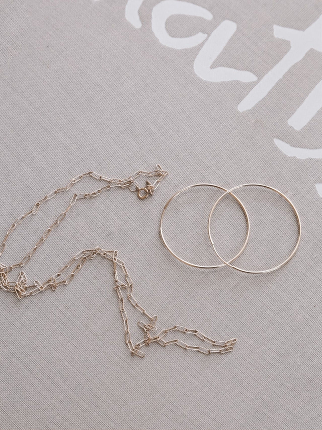 Long Link Chain Necklace styled in flat lay