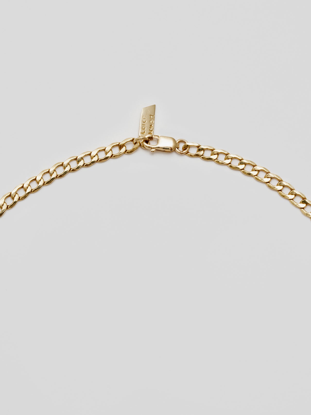 Close up of clasp on 14Kt Yellow Gold Curb Chain Necklace