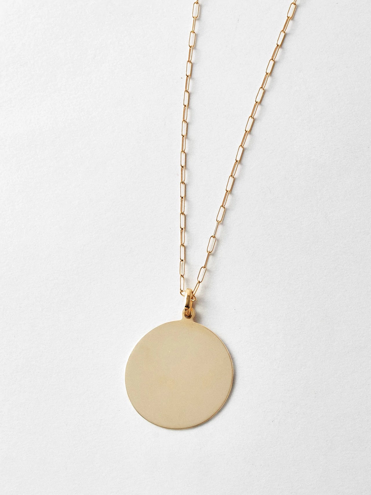 14kt Yellow Gold XL Disk Pendant, 30mm Width, shot on chain. Light grey background.