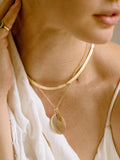 14kt Yellow Gold XL Disk Pendant, 30mm Width, shot on chain on model. 