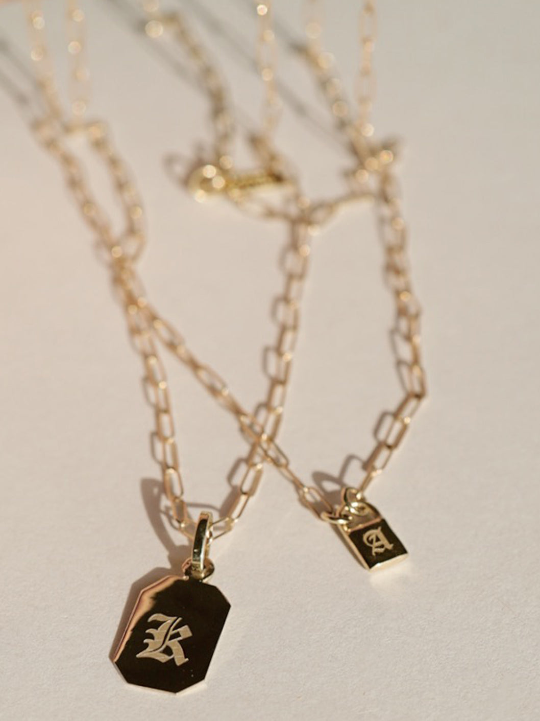 Octagonal ID Pendant shot with engraving: "K"