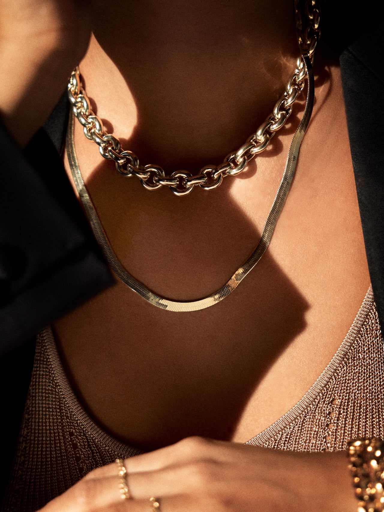 Euclid Necklace: Vermeil Hollow Link Chain pictured on models neck. Styled with the Vermeil Ultra Herringbone Necklace.