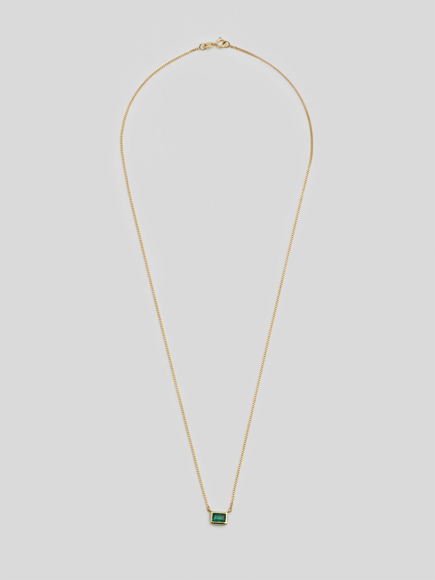 14Kt Yellow Gold Curb Chain with Bezel Cut Emerald
