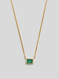 Close up of Emerald on Emerald Cut Bezel Necklace