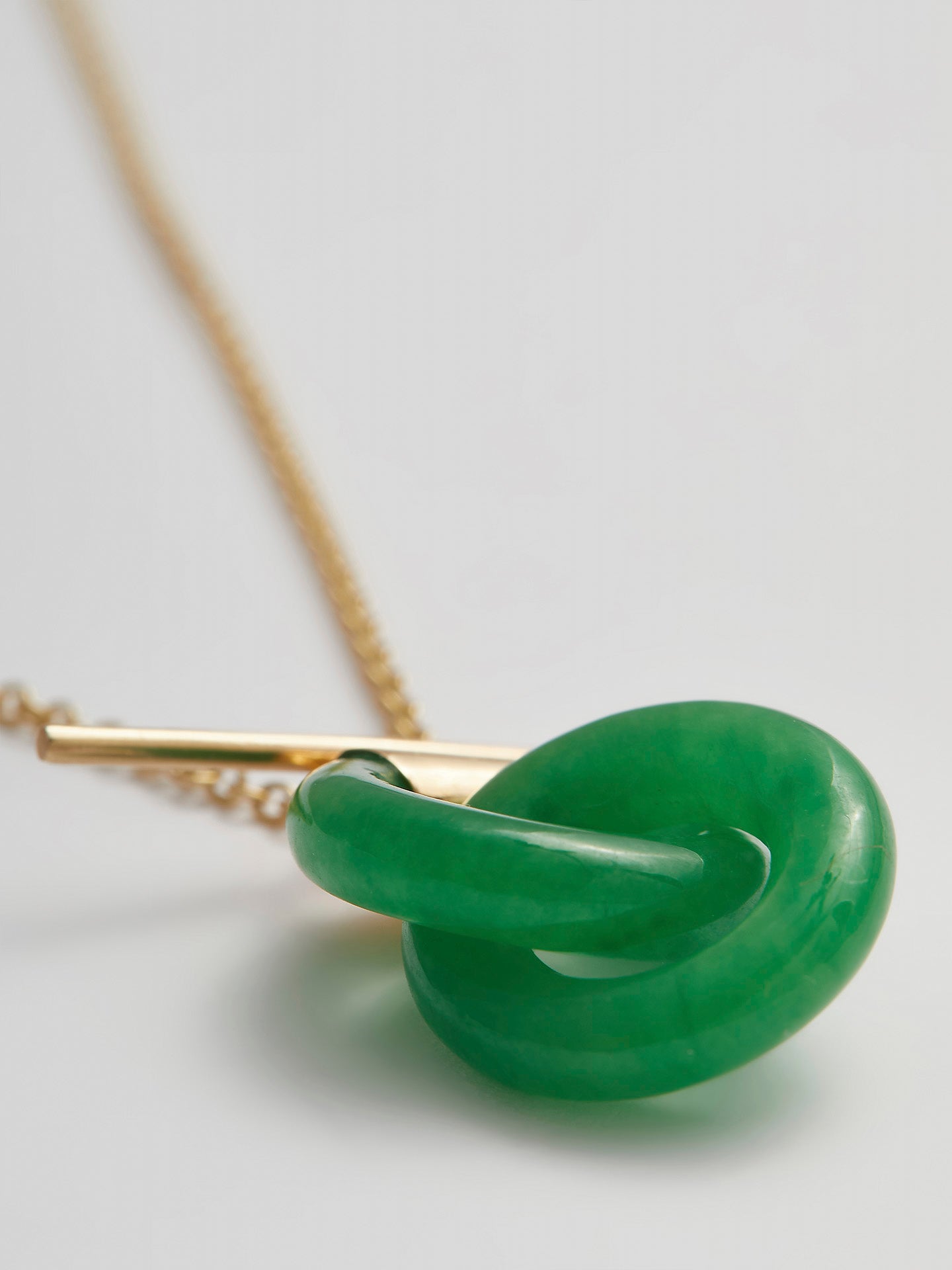 Close-up product shot of the Mini Jade Anais (14kt Yellow Gold Chain Jade Links: 16×4mm) Background: grey backdrop 