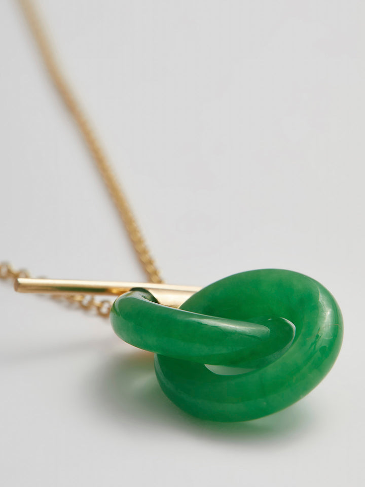Close-up product shot of the Mini Jade Anais (14kt Yellow Gold Chain Jade Links: 16×4mm) Background: grey backdrop 