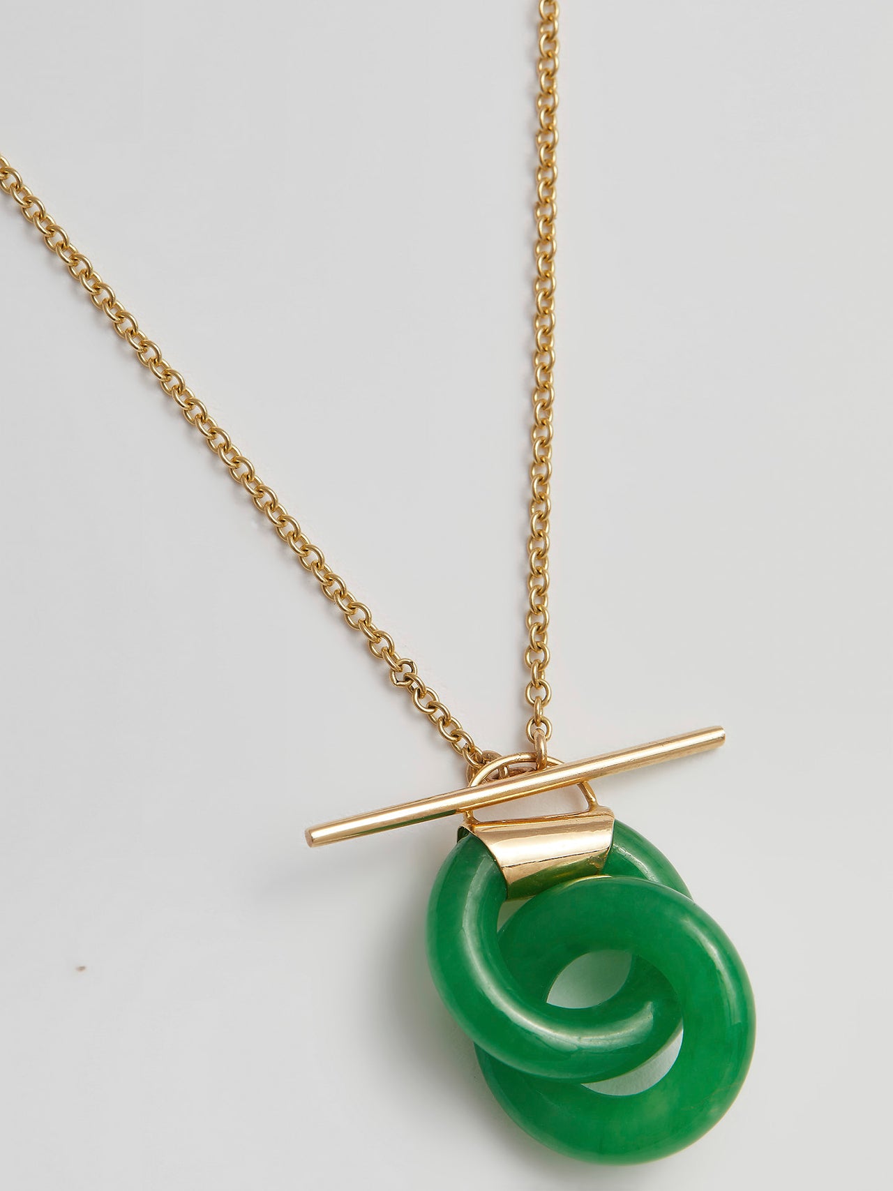 Close-up product shot of the Mini Jade Anais (14kt Yellow Gold Chain Jade Links: 16×4mm) Background: grey backdrop 