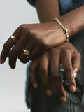 14kt Yellow Gold Baby Signet ring pictured on models ring finger. 